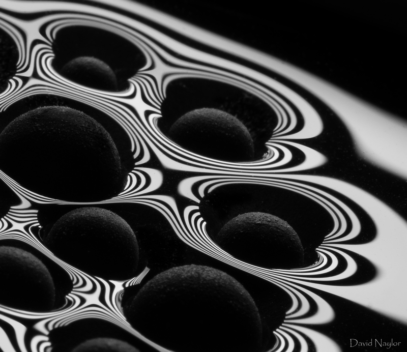 A thin layer of water with superhydrophobic coated spheres